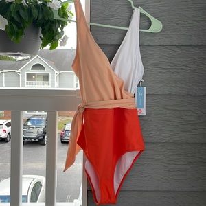 “Cupshe” one piece orange & white bathing suit. Brand new with tags. So cute!